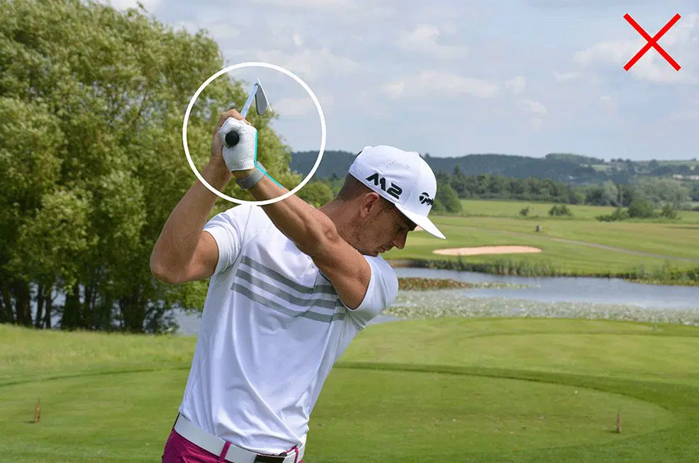 Golfer mid-swing with circled grip, red \"X\" for incorrect technique, green fairways behind. Golfer mid-swing with circled grip, red "X" for incorrect technique, green fairways behind.